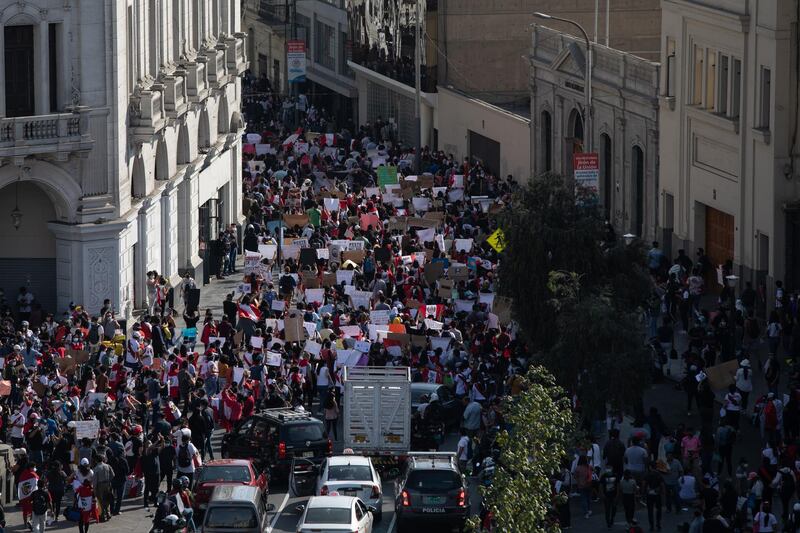Demonstrators march during a protest at San Martin square in Lima. Bloomberg