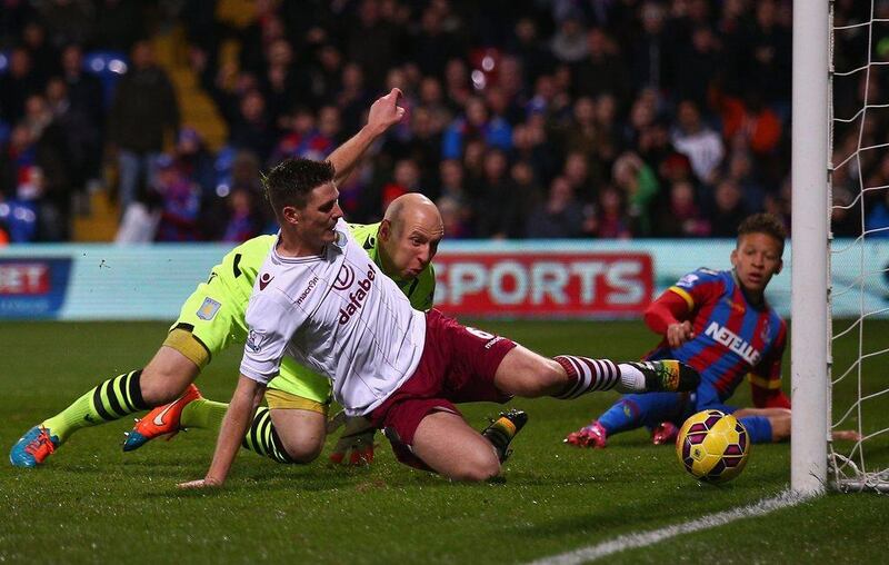 Ciaran Clark of Aston Villa clears the ball off the line as goalkeeper Brad Guzan looks on during their win over Crystal Palace on Tuesday. Ian Walton / Getty Images