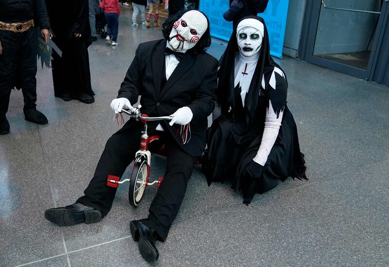 Cosplayers dressed as horror characters Billy the Puppet and The Nun at New York Comic Con. AFP