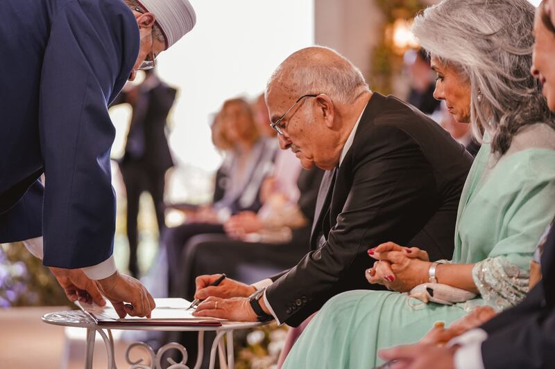 Former Jordanian crown prince Hassan bin Talal, uncle of King Abdullah, signs the marriage certificate at Zahran Palace in Amman. EPA