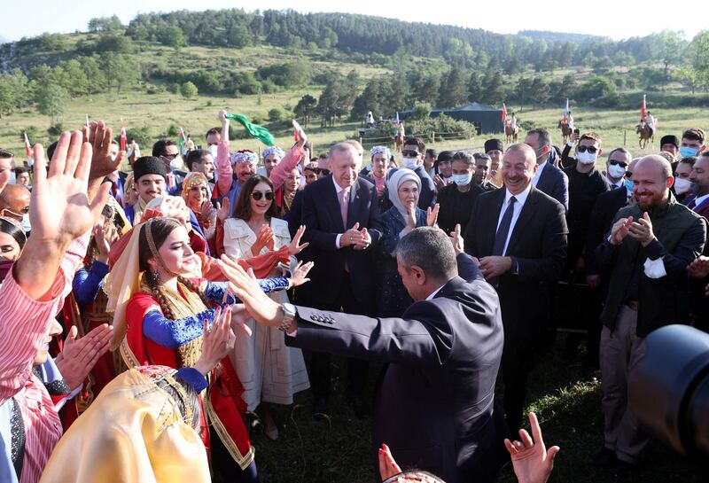 Turkey's President Tayyip Erdogan and Azerbaijan's President Ilham Aliyev, accompanied by their wives Emine Erdogan and Mehriban Aliyeva, attend a local festival in Shusha in Nagorno-Karabakh region, Azerbaijan June 15, 2021. Presidential Press Office/Handout via REUTERS ATTENTION EDITORS - THIS PICTURE WAS PROVIDED BY A THIRD PARTY. NO RESALES. NO ARCHIVE.