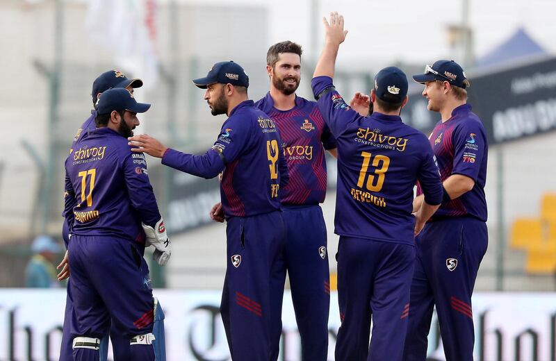 ABU DHABI , UNITED ARAB EMIRATES , Nov 19 – 2019 :- Ben Cutting (center) of Deccan Gladiators celebrating after taking the wicket of  Luke Ronchi
 during the Abu Dhabi T10 Cricket match between Qalanders vs Deccan Gladiators at Sheikh Zayed Cricket Stadium in Abu Dhabi. ( Pawan Singh / The National )  For Sports. Story by Paul
