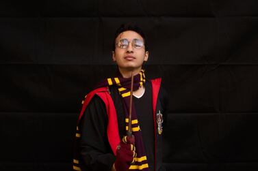 Ahmed Mohammed, 21, poses for a portrait dressed as Harry Potter at EgyCon, an annual gathering for comic book enthusiasts, in Cairo, Egypt, Friday, Jan. 31, 2020. (AP Photo/Maya Alleruzzo)