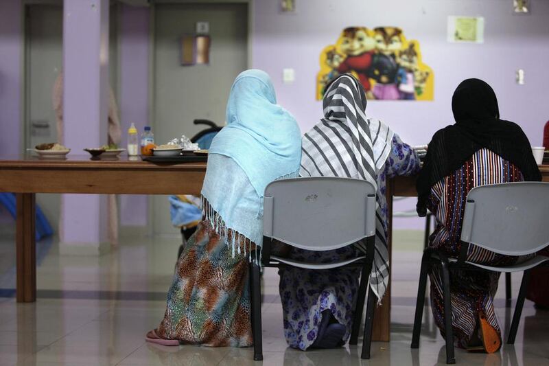 Women eat lunch in the main hal.