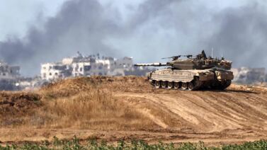 An Israeli army battle tank takes a position in southern Israel near the border with the Gaza Strip. AFP