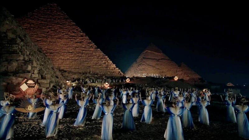 Artists perform near pyramids in a video screened at a ceremony of a transfer of royal mummies from the Egyptian Museum in Tahrir to the National Museum of Egyptian Civilization in Fustat. Reuters