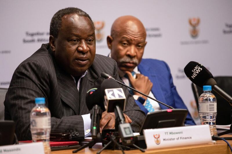 Tito Mboweni, South Africa's finance minister, left, speaks alongside Lesetja Kganyago, governor of South Africa's central bank (SARB), during a news conference before presenting his mid-term budget to parliament in Cape Town, South Africa, on Wednesday, Oct. 30, 2019. Mboweni has to tick many boxes in his medium-term budget: credible fiscal and debt numbers, plans to boost economic growth and policy steps that increase investor and business confidence. Photographer: Dwayne Senior/Bloomberg