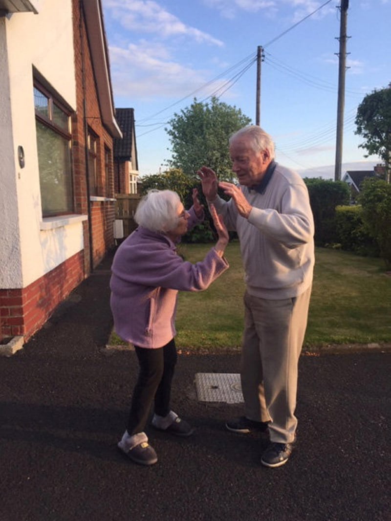 I took this photo of my next door neighbours, Gladys and Jack. Jack is in his 90s and they both came out every Thursday to clap for the NHS. They are an inspirational couple and still very much in love. They encouraged others to come out and clap and waved to everyone in the street. They are lovely neighbours to have and I am lucky to live next door by TRICIA GILMORE

