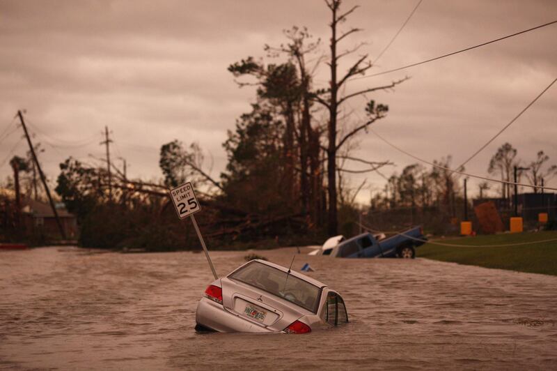 Vehicles sit partially submerged in floodwaters after Hurricane Michael hit in Panama City, Florida. Bloomberg