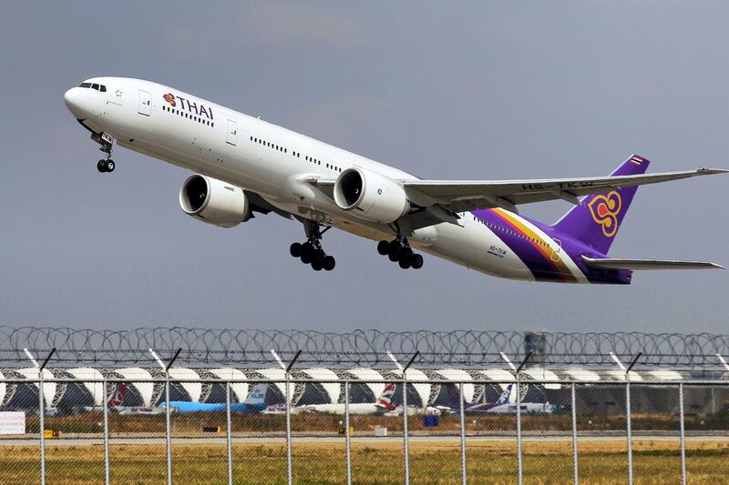 A Thai Airways Boeing 777-300ER plane takes off from Bangkok's Suvarnabhumi Airport February 23, 2015. REUTERS/Chaiwat Subprasom (THAILAND - Tags: TRANSPORT BUSINESS) - GF2EB2N0N8M01