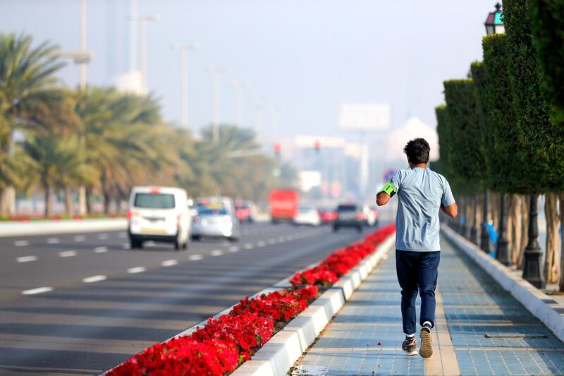 Abu Dhabi, United Arab Emirates, March 1, 2020.  
Standalone:  A runner on the Corniche, Abu Dhabi, on a foggy morning.
Victor Besa / The National
Section:  NA
Reporter: