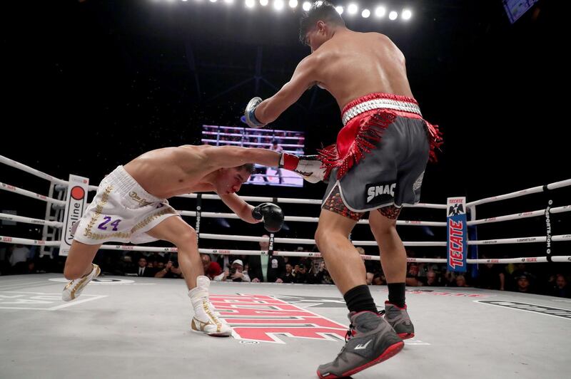 Mikey Garcia knocks down Jessie Vargas in the fifth round. AFP