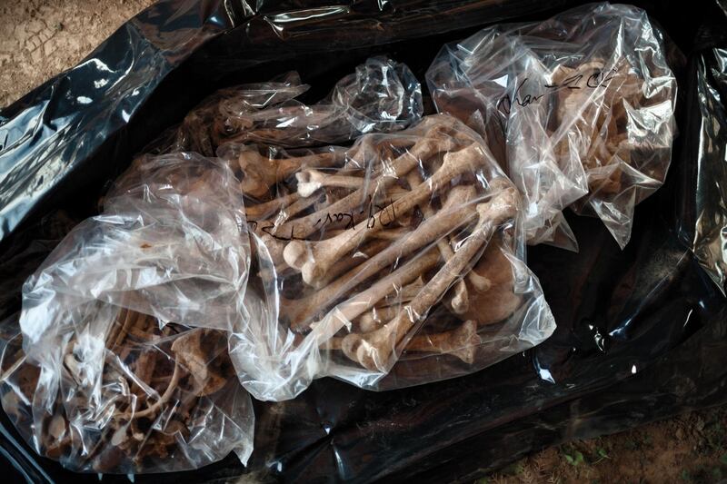 TOPZAWA, IRAQ: A bag of human bones exhumed from a mass grave. Photo by  Sebastian Meyer