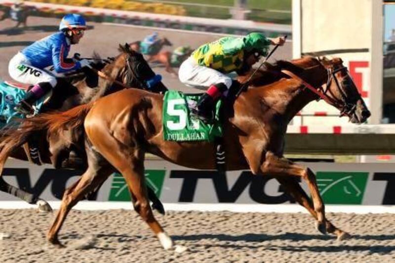 In this photo provided by Benoit Photo, Donegal Racing's Dullahan and jockey Joel Rosario, right, fly by Game On Dude (Chantal Sutherland), left, to win the Grade I $1,000,000 Pacific Classic horse race, Sunday, Aug. 26, 2012, at Del Mar Thoroughbred Club in Del Mar, Calif. (AP Photo/Benoit Photo)