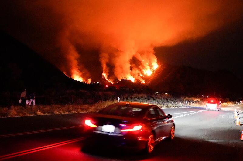 Heatwave conditions were making difficult work for fire crews battling brush fires and wildfires across Southern California. AP