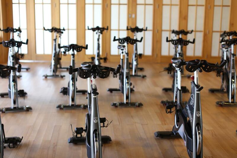 Attend Spinning classes at The Room, where the indoor cycling cardiovascular sessions are based on training science. Courtesy The Room