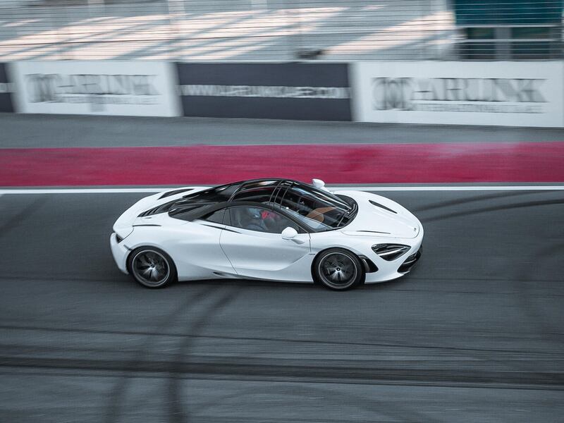 A McLaren GT tears up the Dubai Autodrome straight.