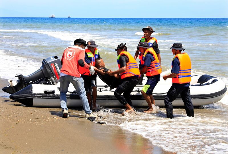 Medics participate in an Indian ocean earthquake and tsunami drill on a beach in Dili, East Timor on 13 October 2020. The drill was staged to improve disaster preparedness.All photos by Antonio Dasiparu / EPA