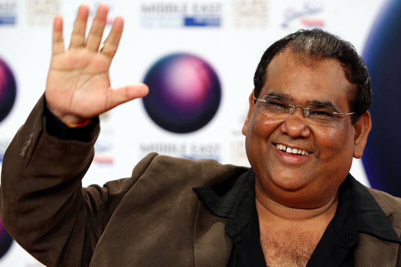 Abu Dhabi - October 16, 2008 - Bollywood director Satish Kaushik waves to photographers on the red carpet before the screening of his film, Karzzzz, during the Middle Eastern International Film Festival at Emirates Palace in Abu Dhabi, October 16, 2008. ( Jeff Topping / The National) *** Local Caption ***  JT011-1016-BOLLYWOOD KARZZZZ 7F8Q3960.jpgJT011-1016-BOLLYWOOD KARZZZZ 7F8Q3960.jpg