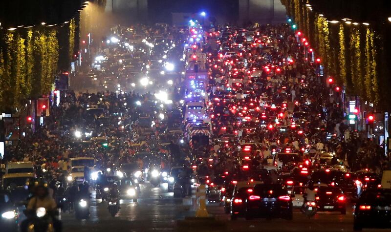 Fans fill  the Champs Elysees. Reuters