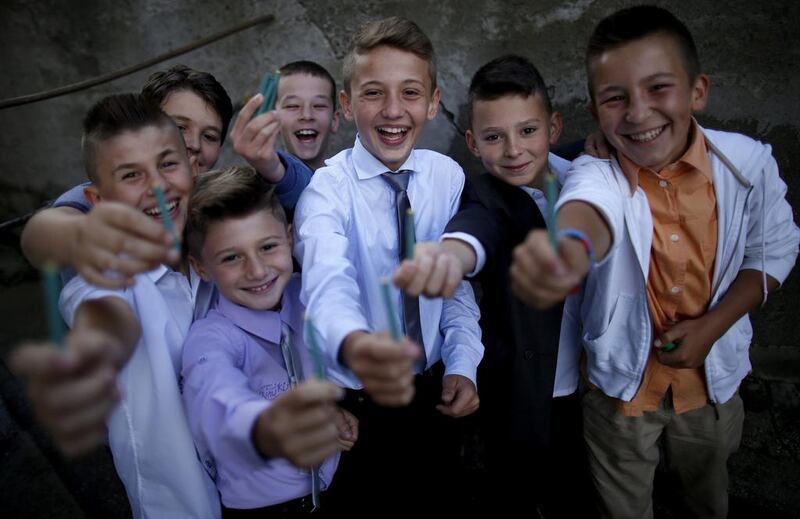 Muslim boys show their firecrackers after morning prayers at the entrance of a mosque in the village of Zeljezno Polje, Bosnia on July 28, 2014. Dado Ruvic/Reuters