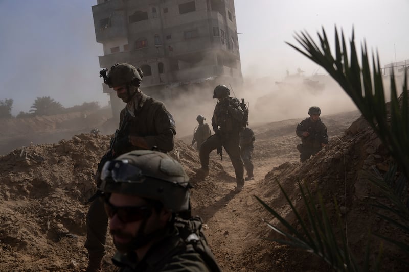Israeli soldiers take up positions during a ground operation in Khan Younis. AP