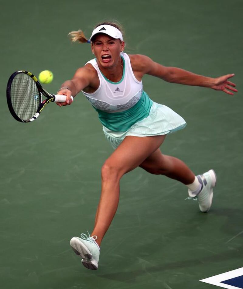 Caroline Wozniacki rallied back for her first-round victory over Sabine Lisicki on Tuesday in Dubai. Ali Hader / EPA