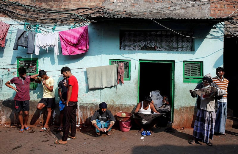 People brush their teeth as others read newspapers on a winter morning in Kolkata, India. Rupak De Chowdhuri / Reuters
