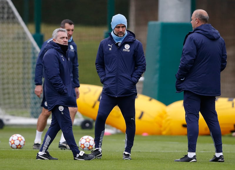 City manager Pep Guardiola with his coaching staff. Reuters