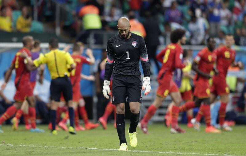 Tim Howard of the United States reacts after their loss to Belgium on Tuesday night at the 2014 World Cup. Julio Cortez / AP