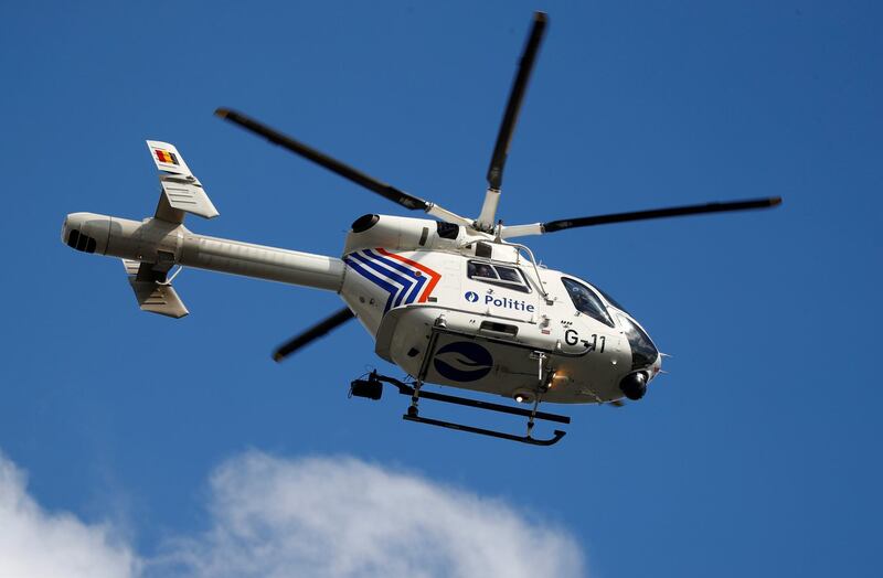 A Belgian police helicopter flies overhead. Reuters