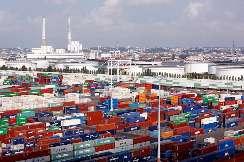 Containers sit stacked at Port 2000 terminal in Le Havre harbour, eastern France, Thursday, Sept. 6, 2018. (AP Photo/Thibault Camus)