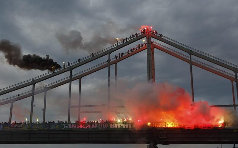 Football fans burn torches on a bridge in Kiev, Ukraine. About two thousand football fans of six Ukrainian clubs burn flares for support of Single Ukraine at a bridge across Dnieper River. Iron Moroz / EPA