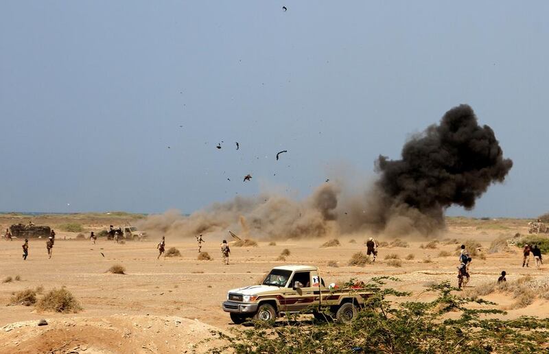A landmine explodes as Yemeni loyalist forces patrol an area near the Red Sea port town of Mokha on January 20, 2017.  Saleh Al Obeidi / AFP 

