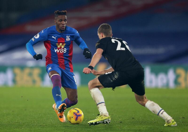 West Ham United's Tomas Soucek in action with Crystal Palace's Wilfried Zaha. Reuters