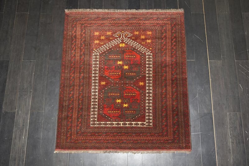 Afghan Qizilayak prayer rug, 70-80 years old.  Antonie Robertson / The National