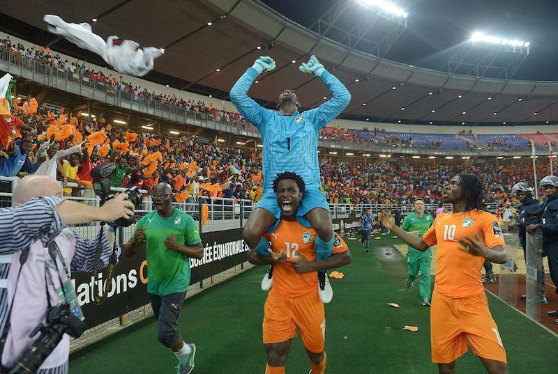 Ivory Coast's Wilfried Bony carries goalkeeper Boubacar Barry on his shoulders as they celebrate with forward Gervinho after winning the 2015 Africa Cup of Nations final against Ghana. Carl de Souza / AFP