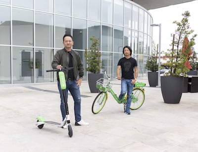 LimeBike co-founders Toby Sun and Brad Bao stand with bike and scooter prototypes outside of the company's headquarters in San Mateo, CA on May 22, 2018.Images by Cayce Clifford