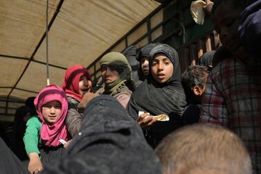 Children stand in the back of a truck near the village of Baghouz, Syria. Reuters.