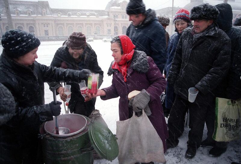 People braving heavy snow to receive free soup offered by the Salvation Army in central Moscow in 1998, a year in which a third of Russia’s population was below the poverty line. Oleg Nikishin / AP Photo