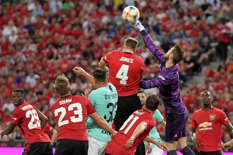 Manchester United's goalkeeper David de Gea punches the ball clear. AFP