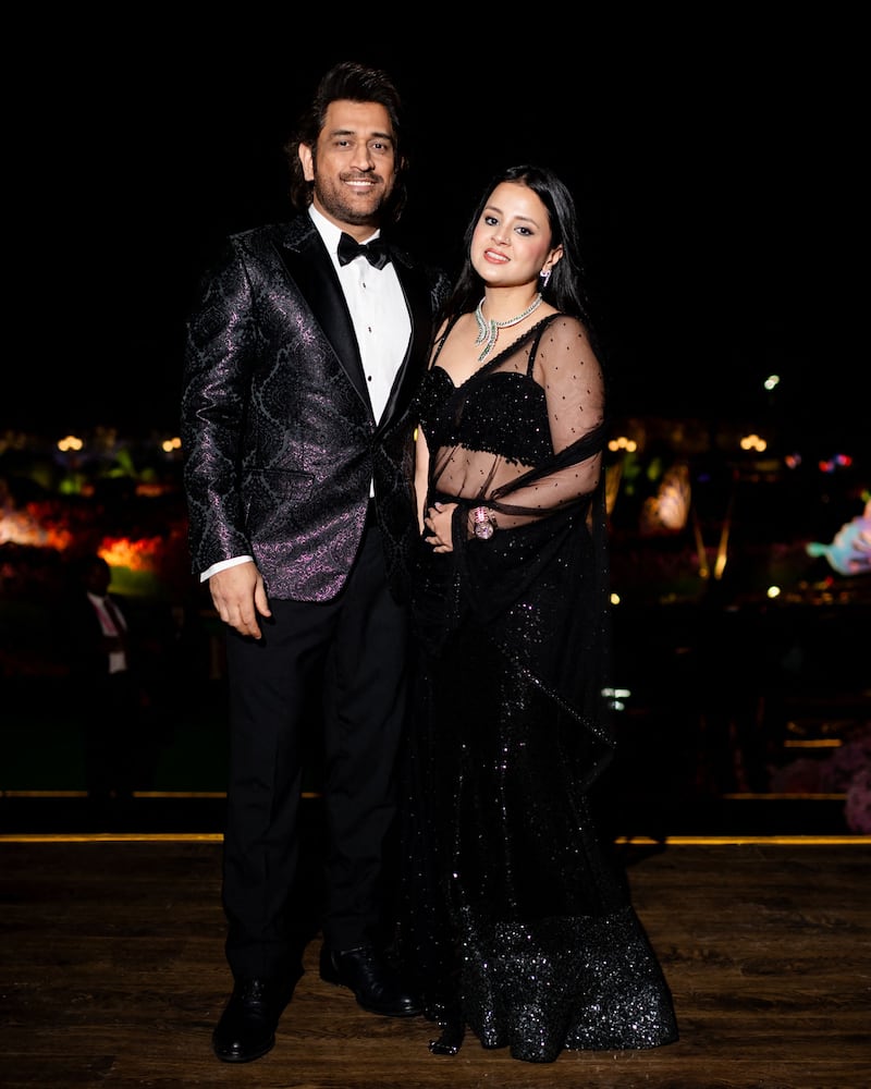 India's former cricket captain Mahendra Singh Dhoni with wife Sakshi 
