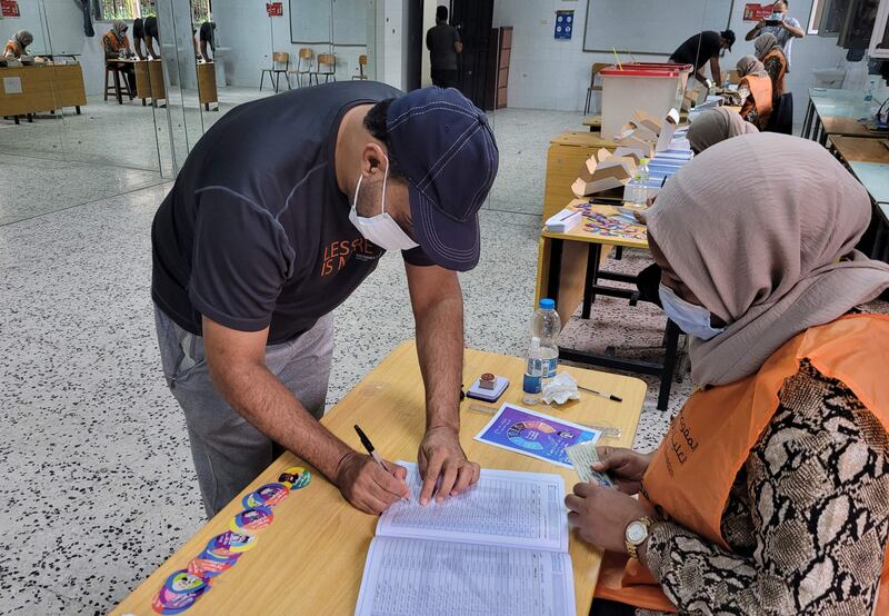 A Libyan man registers to vote inside a polling station in Tripoli on November 8. AFP