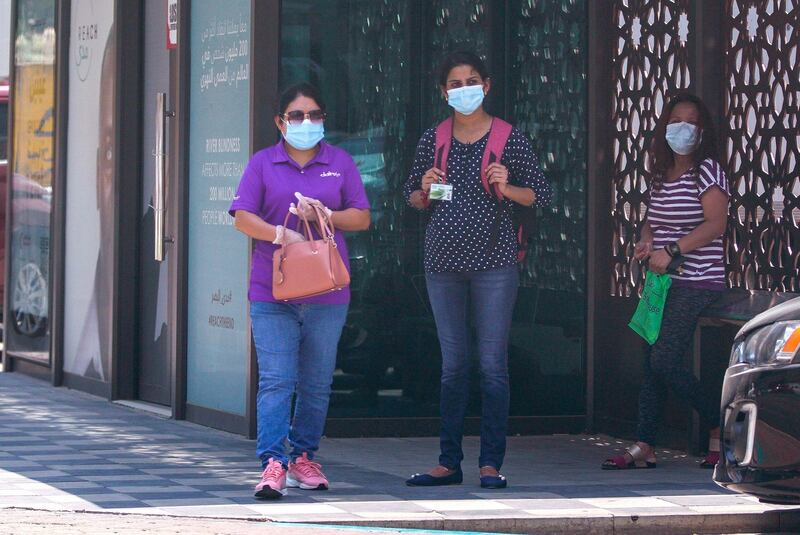 Abu Dhabi, United Arab Emirates, June 3, 2020.   
Commuters at a bus stop protect themselves with face masks during the Covid-19 pandemic along Zayed the First Street.
Victor Besa  / The National
Section:  Standalone / Stock
