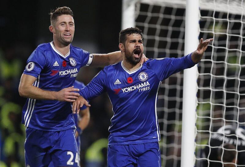 Chelsea’s Diego Costa, right, celebrates scoring the third goal with teammate Gary Cahill. Kirsty Wigglesworth / AP Photo