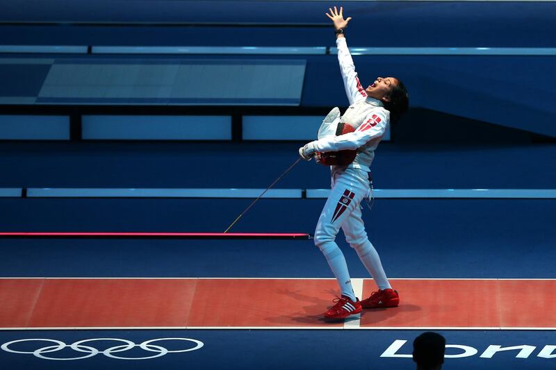 LONDON, ENGLAND - JULY 28:  Ines Boubakri of Tunisia celebrates winning her Women's Foil Individual Fencing round of 32 match against Nicole Ross of the United States on Day 1 of the London 2012 Olympic Games at ExCeL on July 28, 2012 in London, England.  (Photo by Hannah Peters/Getty Images)