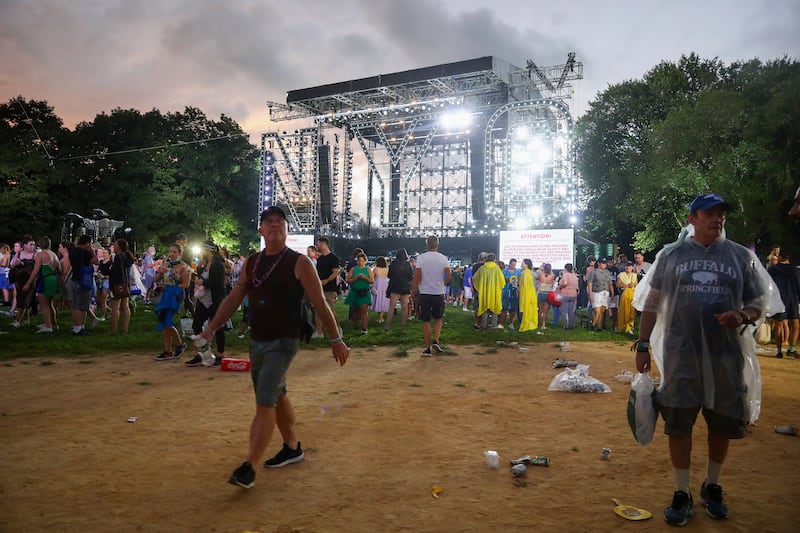 Concertgoers exit The Great Lawn in Central Park after organisers cancel the 'We Love NYC: The Homecoming Concert' due to approaching thunderstorms. AP