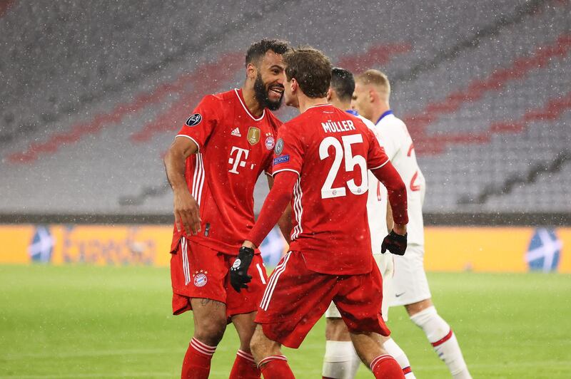 Thomas Muller celebrates with team mate Eric Maxim Choupo-Moting after levelling the scores. Getty