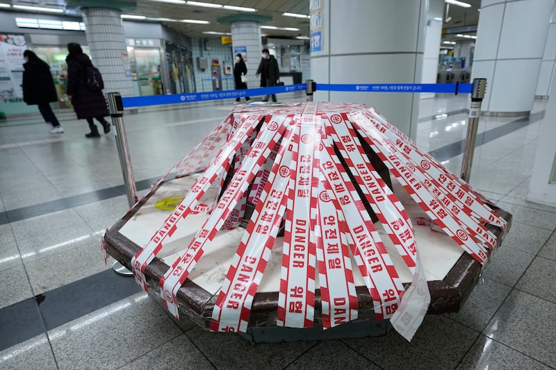 A bench taped off to enforce social distancing measures at a subway station in Seoul, South Korea. AP