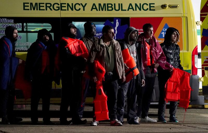 A group of people thought to be migrants are brought in to Dungeness, in Kent, England, after a small-boat incident in the Channel on Wednesday night. AP